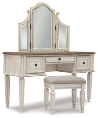 Realyn Queen Upholstery Panel Bed, Dresser, Chest, Nightstand, and Vanity Set