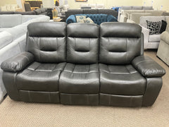FLOOR MODEL RECLINING SOFA GREY FABRIC.